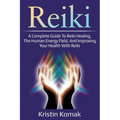 Book cover for 'Reiki: A Complete Guide To Reiki Healing, The Human Energy Field, And Improving Your Health With Reiki' by Kristin Komak, featuring a purple background with the title in large gradient letters and glowing hands at the center.
